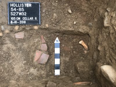 sherds and bone on floor